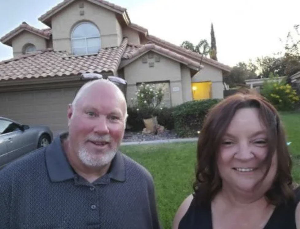 picture of William B. in front of a house