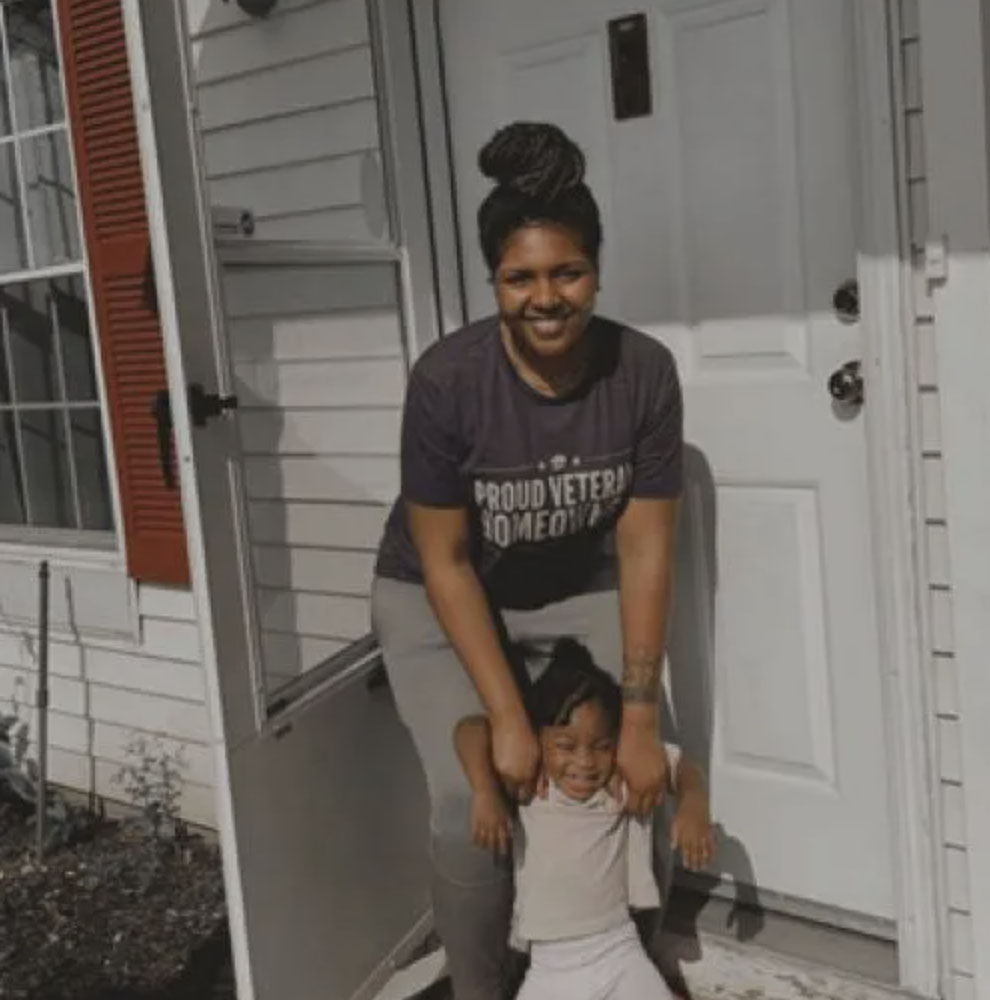 picture of Shanna W. in front of a house