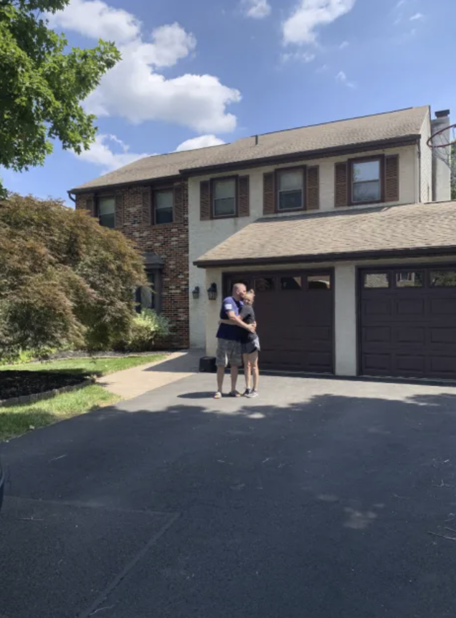 picture of David P. in front of a house